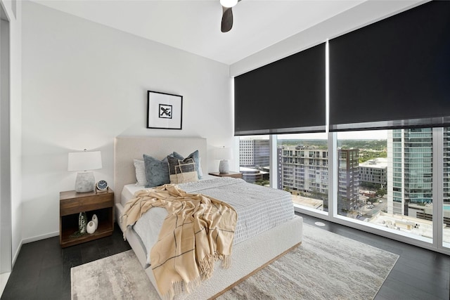 bedroom featuring access to exterior, ceiling fan, and hardwood / wood-style flooring