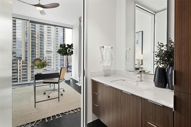 bathroom featuring vanity, floor to ceiling windows, and ceiling fan