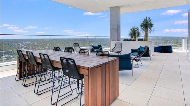 view of patio featuring an outdoor hangout area and an outdoor bar