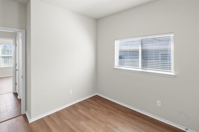 unfurnished room with light hardwood / wood-style floors