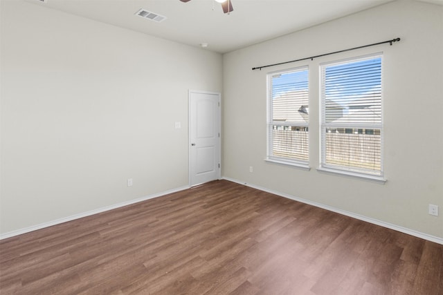 spare room featuring hardwood / wood-style flooring and ceiling fan