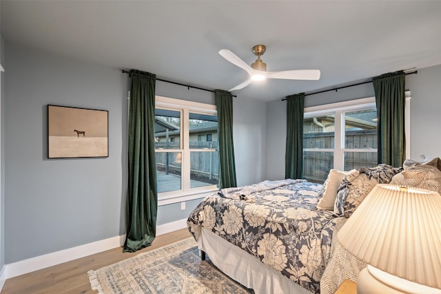 bedroom featuring hardwood / wood-style floors and ceiling fan