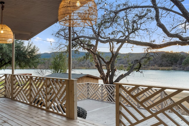 wooden deck featuring a water view