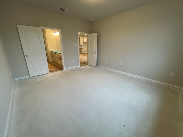 unfurnished bedroom featuring ensuite bath