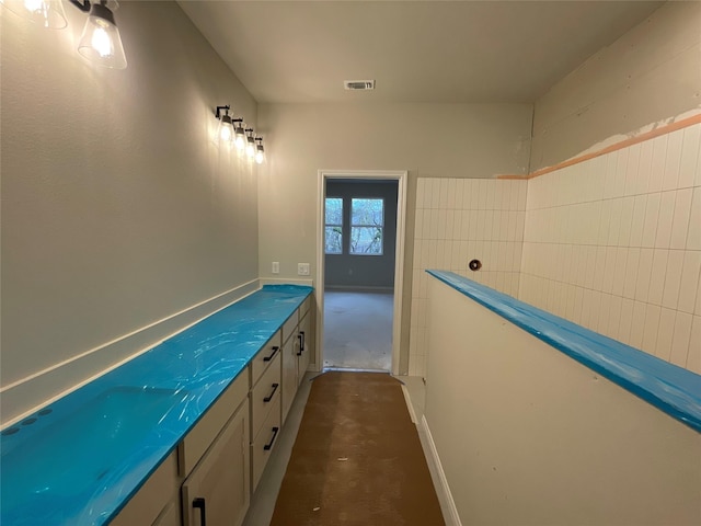 bathroom with concrete floors