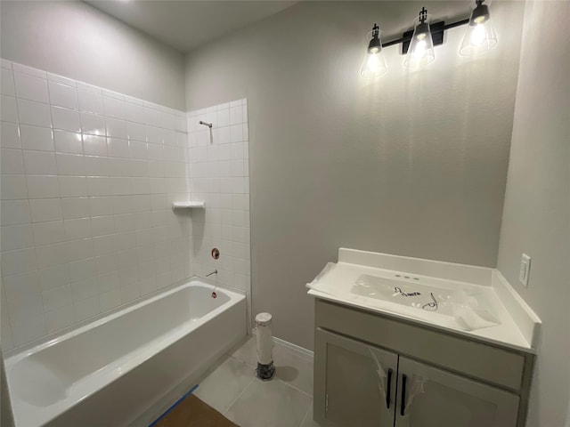 bathroom with washtub / shower combination, tile patterned floors, and vanity