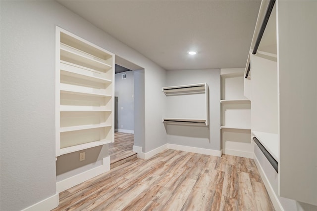 spacious closet with light wood-type flooring