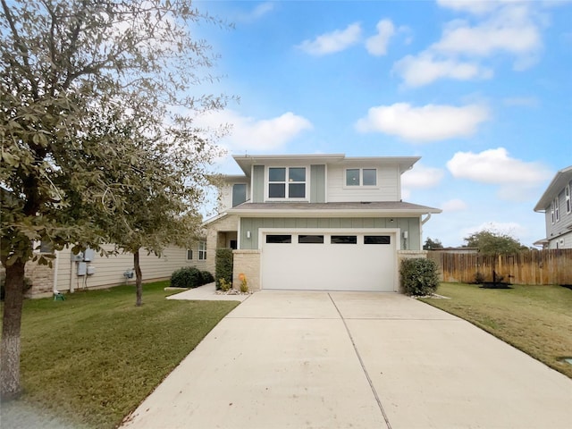 view of front facade featuring a front yard and a garage