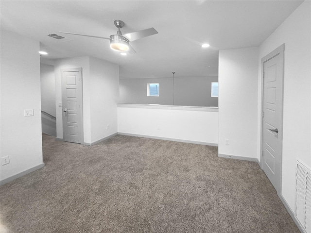 interior space with ceiling fan and carpet floors