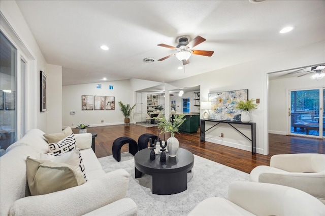 living room featuring ceiling fan and hardwood / wood-style floors