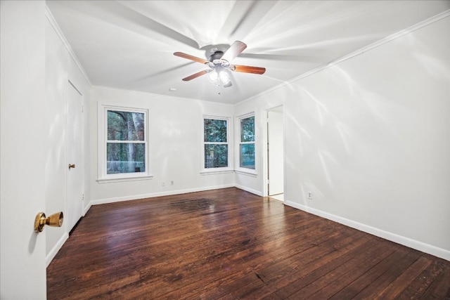 unfurnished room featuring dark wood-type flooring, ceiling fan, and ornamental molding