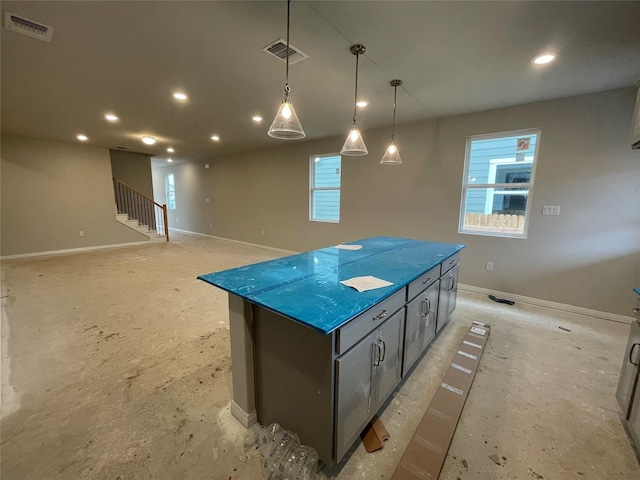 kitchen featuring decorative light fixtures and a kitchen island