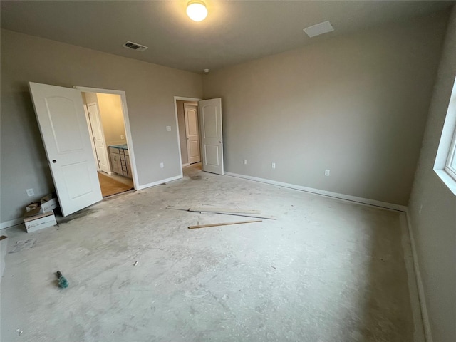 unfurnished bedroom with connected bathroom