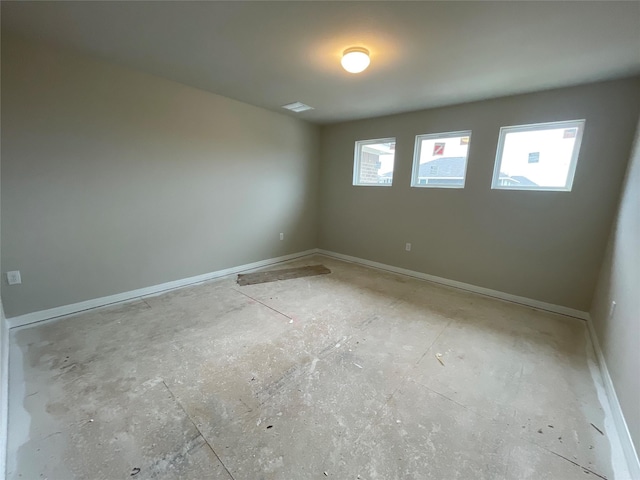 unfurnished room featuring a healthy amount of sunlight