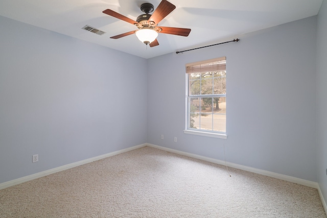 empty room featuring carpet flooring and ceiling fan