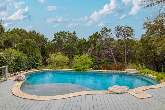 view of pool with a wooden deck