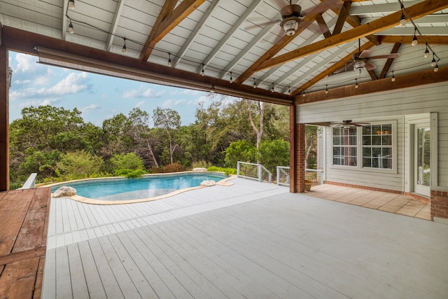 view of pool featuring ceiling fan and a wooden deck