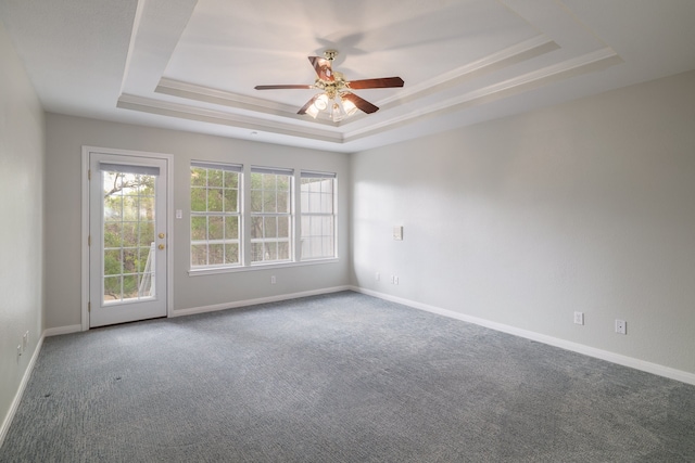 unfurnished room with carpet, a raised ceiling, and ceiling fan