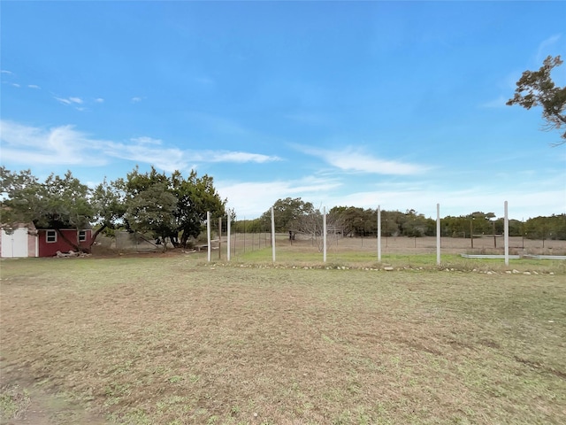 view of yard with a rural view