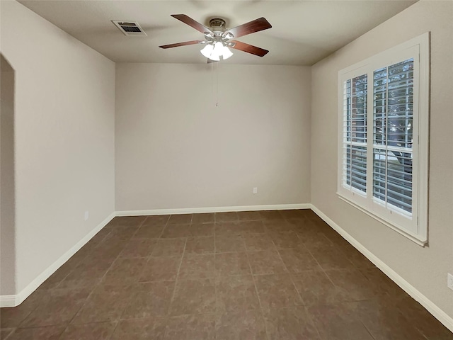 spare room with ceiling fan