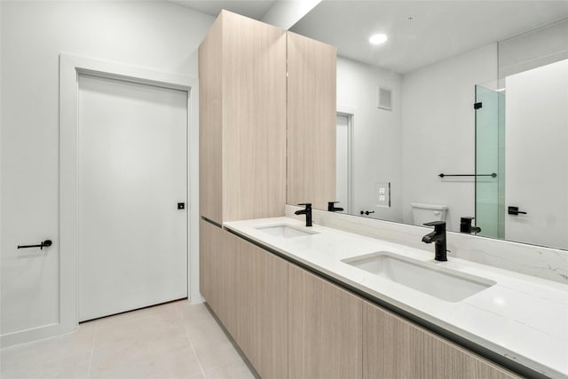 full bathroom featuring a sink, visible vents, toilet, and tile patterned floors