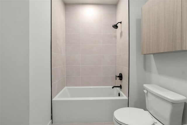 bathroom featuring toilet and  shower combination