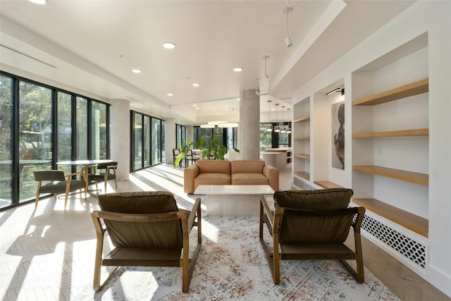 living area with visible vents and recessed lighting