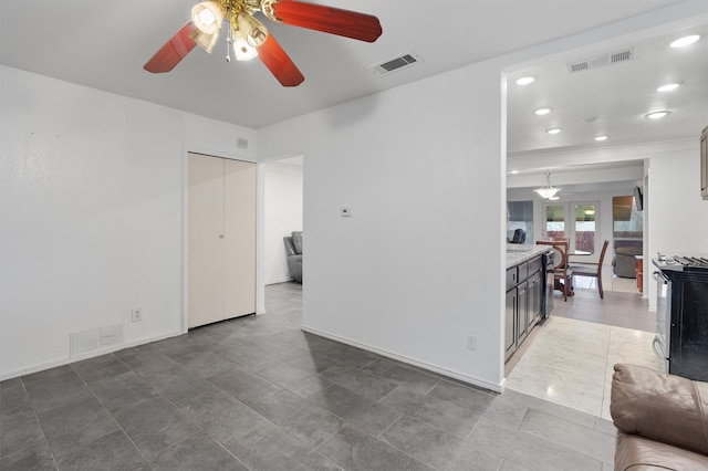 unfurnished room featuring ceiling fan and french doors