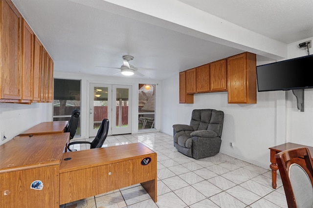 home office featuring french doors and ceiling fan