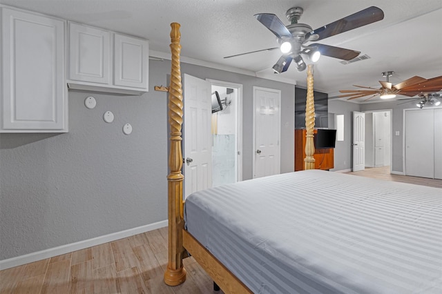 bedroom with light hardwood / wood-style flooring and ceiling fan