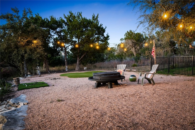 view of yard at dusk