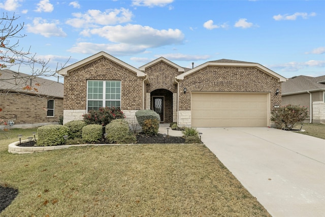 view of front of house with a front yard and a garage