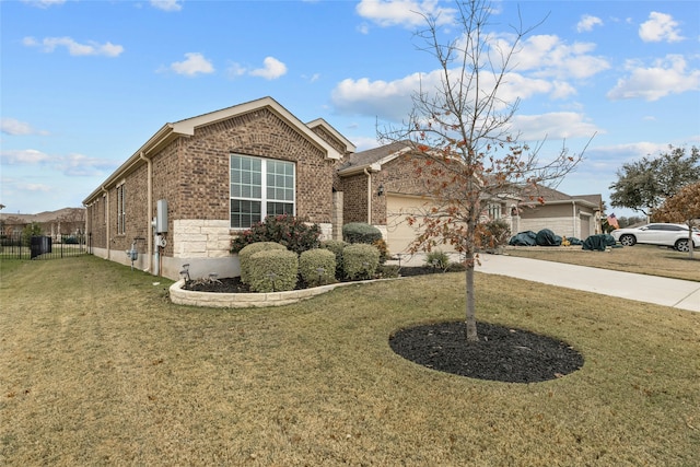 view of front of property featuring a garage and a front lawn