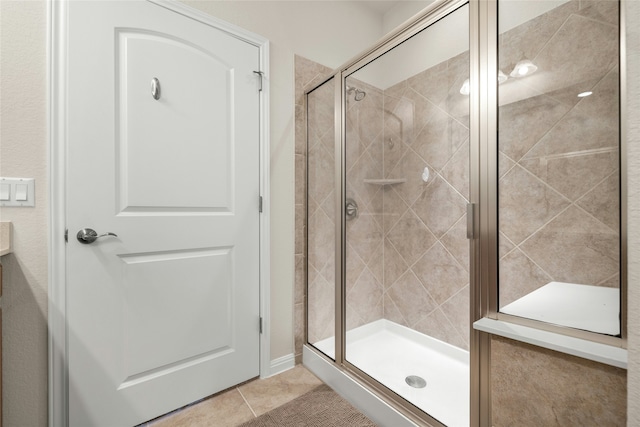 bathroom featuring tile patterned flooring and walk in shower