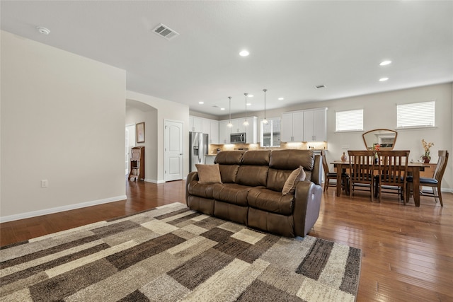 living room with dark wood-type flooring