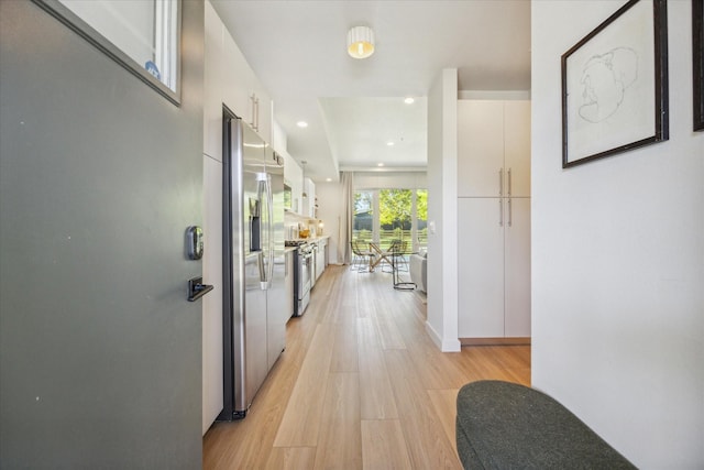 corridor featuring light hardwood / wood-style floors