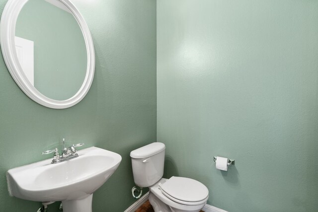 bathroom with sink and toilet