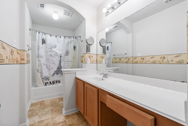 bathroom with vanity and shower / bathtub combination with curtain