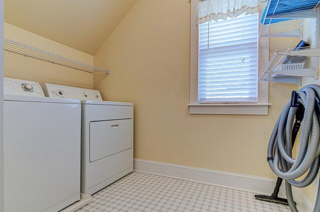 clothes washing area featuring washing machine and clothes dryer