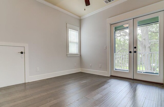 empty room with french doors, plenty of natural light, and ornamental molding