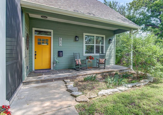 property entrance with covered porch