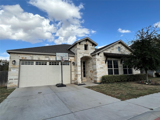 french country style house with a garage