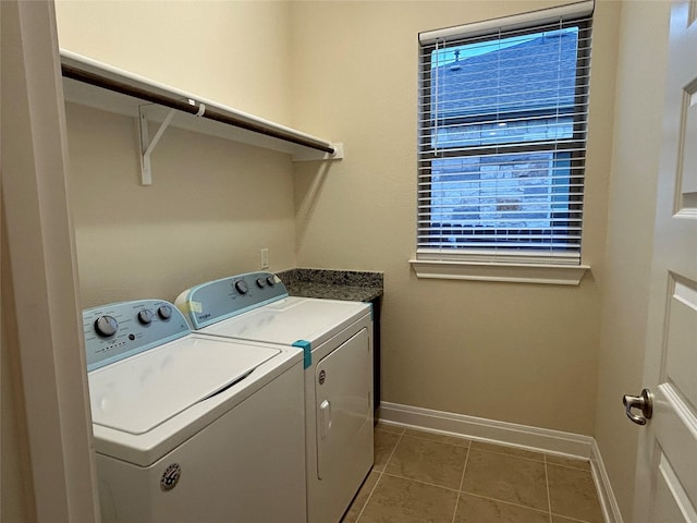 laundry room with tile patterned flooring and washer and dryer