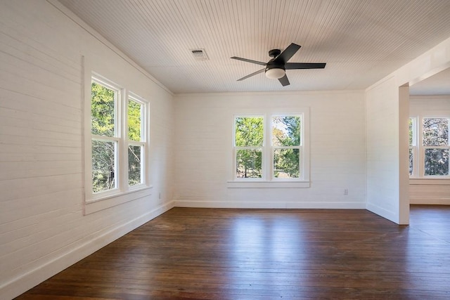 spare room with ceiling fan, dark hardwood / wood-style flooring, and ornamental molding