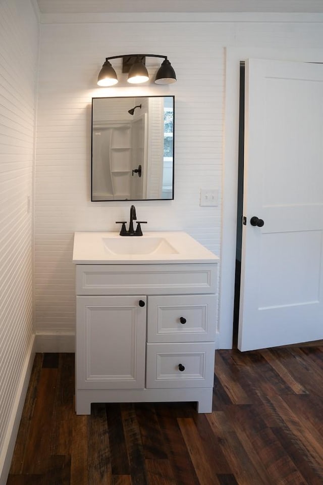 bathroom with vanity and wood-type flooring