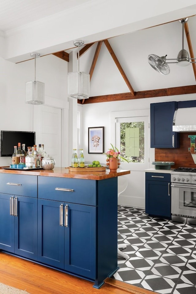 kitchen featuring high end white range oven, blue cabinetry, hanging light fixtures, backsplash, and range hood