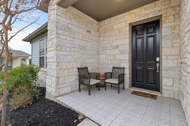 entrance to property featuring covered porch