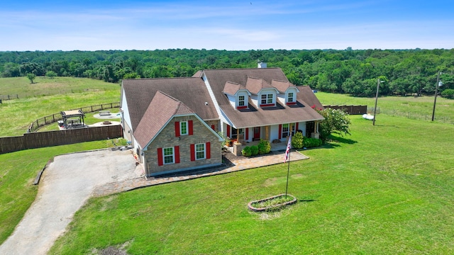 view of front of property featuring a front yard and covered porch