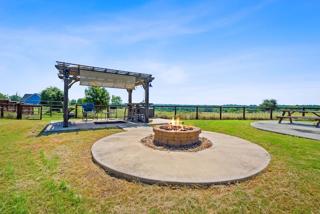 view of patio with a fire pit, fence, and a pergola