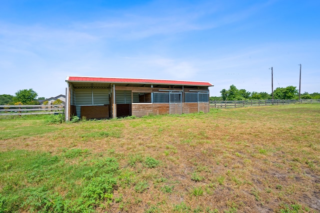 view of outdoor structure with a rural view, an outdoor structure, and an exterior structure